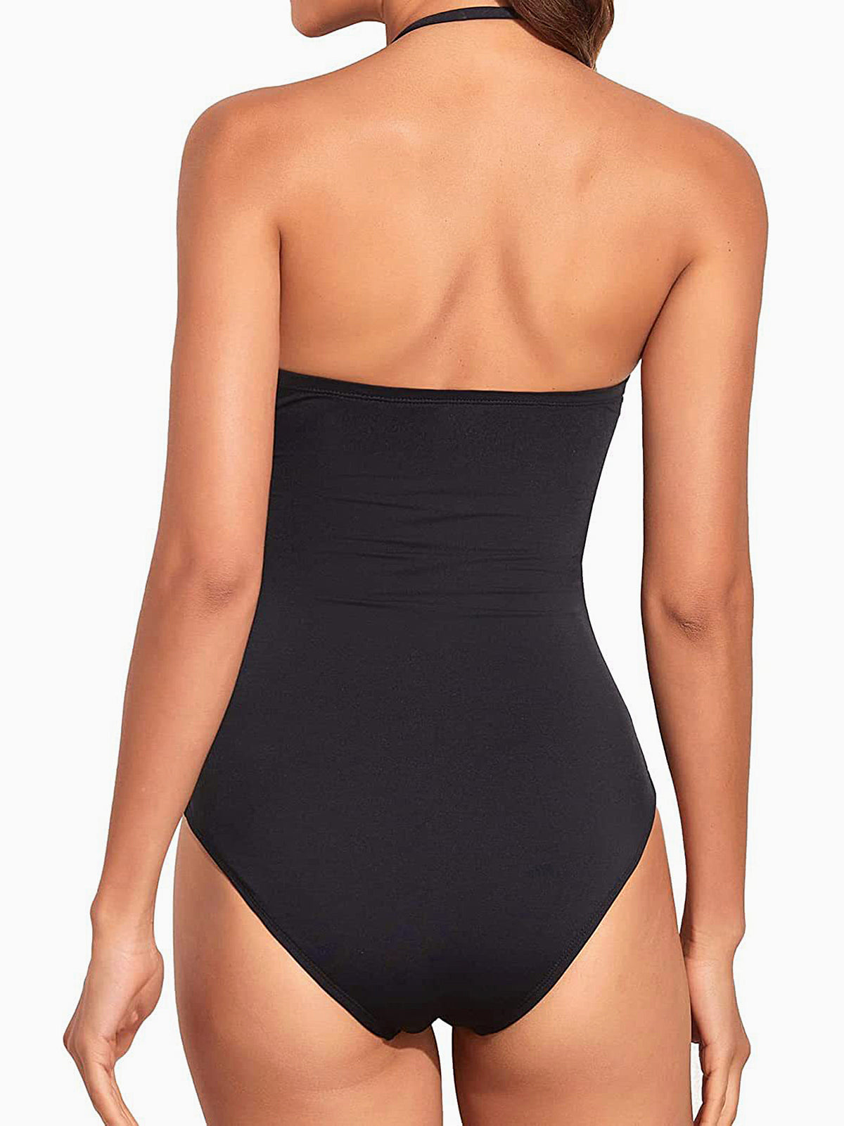 Back view of a woman wearing a black strapless one-piece swimsuit