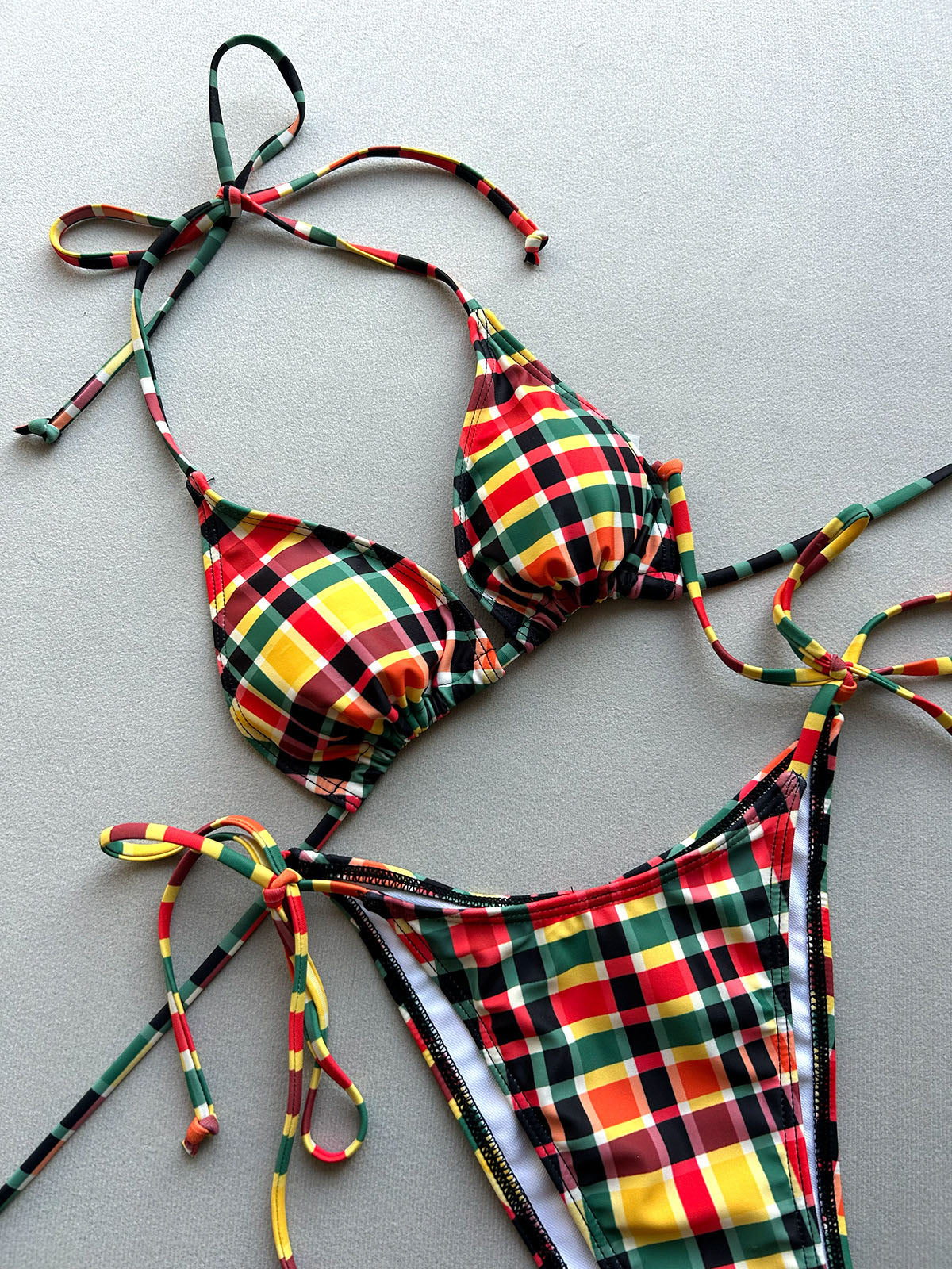 Plaid bikini top and bottom laid flat