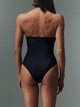 Black one-piece swimsuit, back view