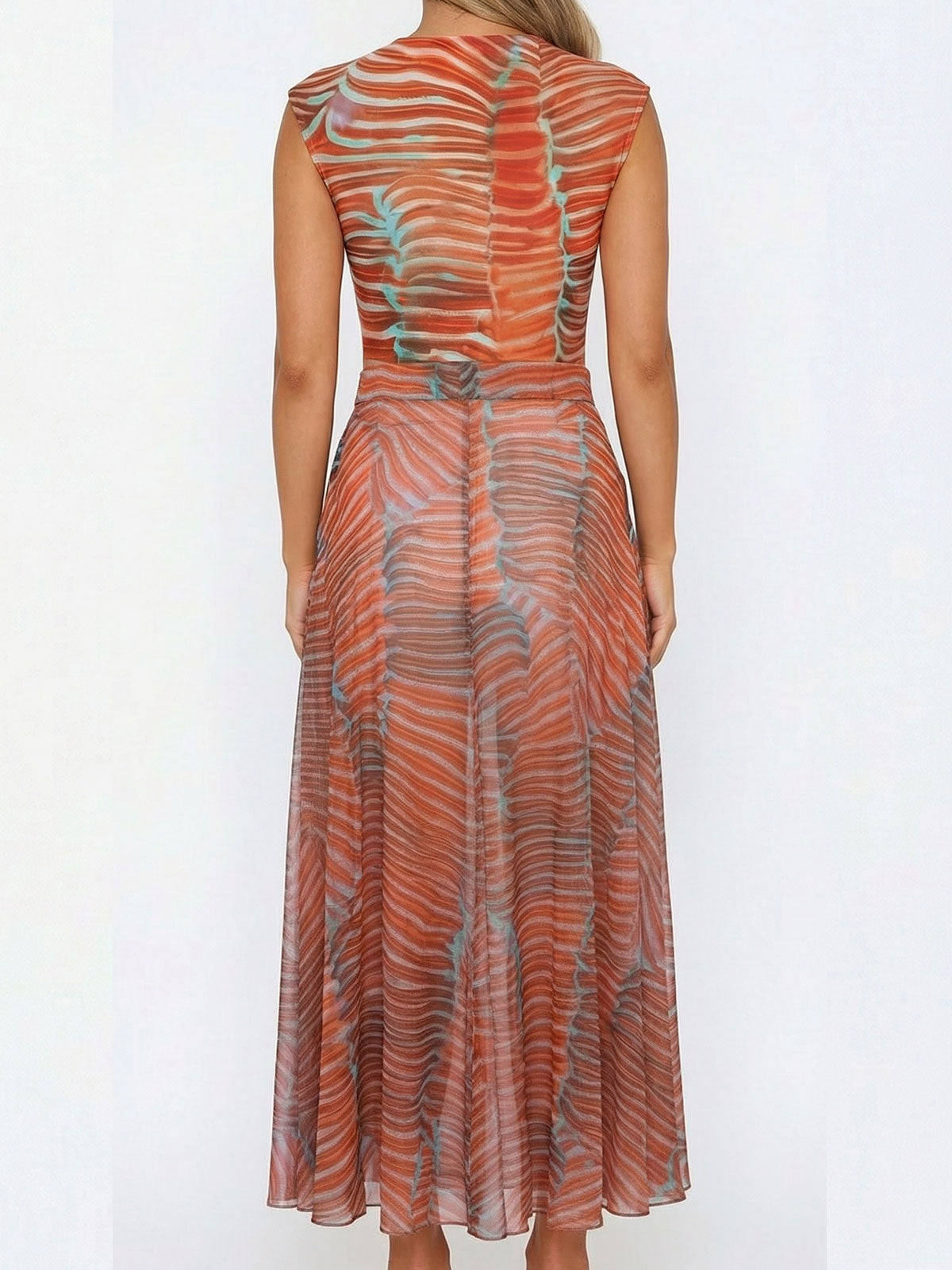 back view of a woman wearing a long orange and blue striped sheer knit dress