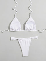 White ribbed bikini set laid flat, showing the reverse side of the top and bottom