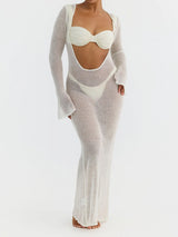 Woman wearing a white sheer knit maxi dress over a white bikini