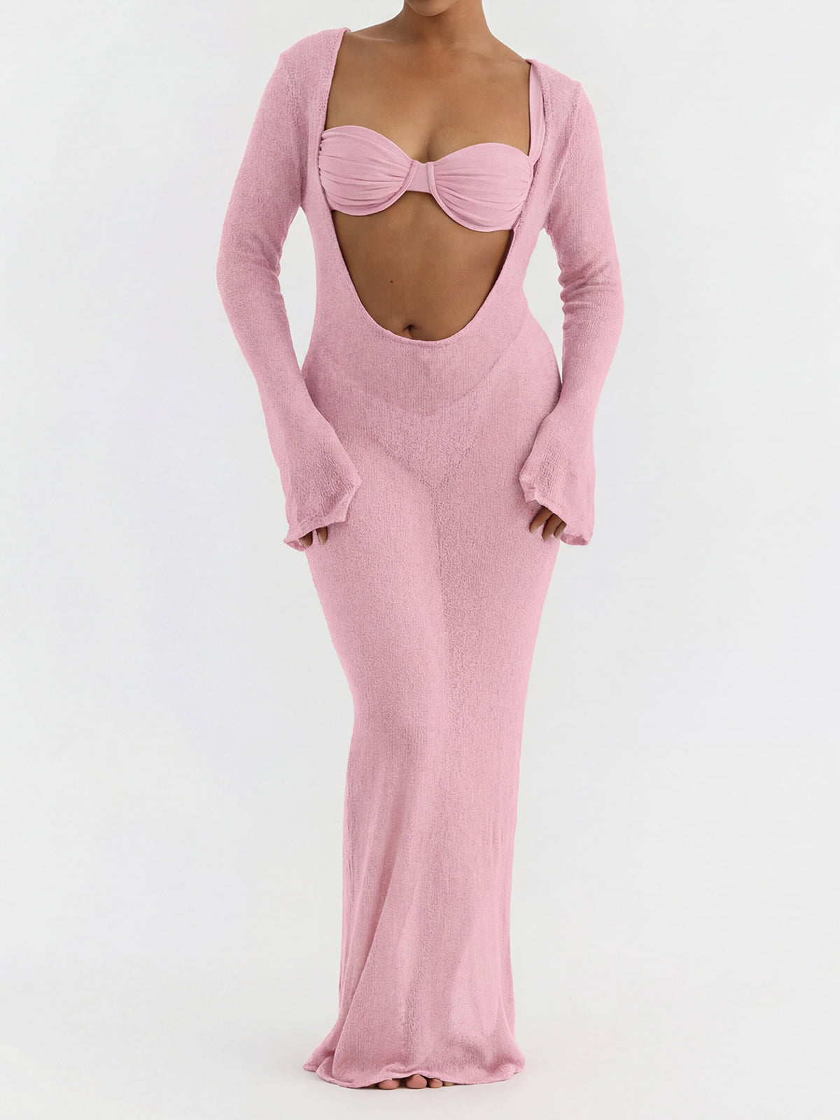 Woman wearing a pink sheer knit maxi dress over a pink bikini