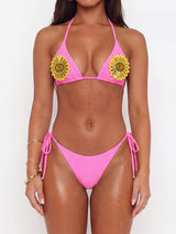 Pink bikini set with sunflower applique details on the bust and adjustable tie closures.